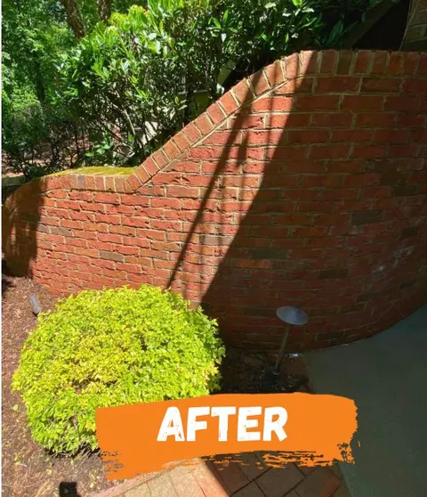 After: the wall clean red brick.